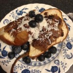 Baked stuffed pears with coconut & blueberries